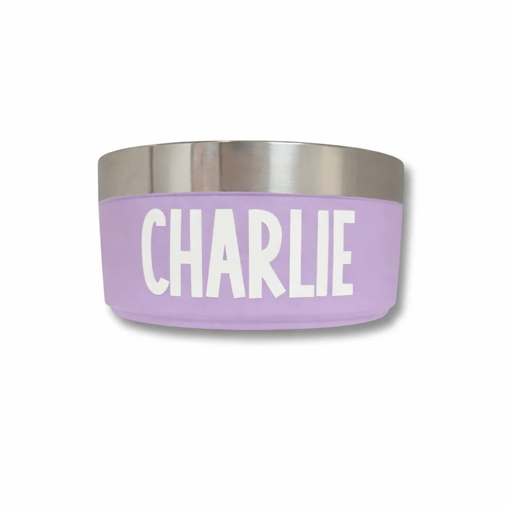 Purple pet bowl with 'CHARLIE' printed on it against a white background