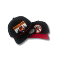 Two black baseball caps with 'Wolf Pack' logos on a white background