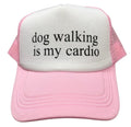Pink and white cap with 'dog walking is my cardio' text on a white background